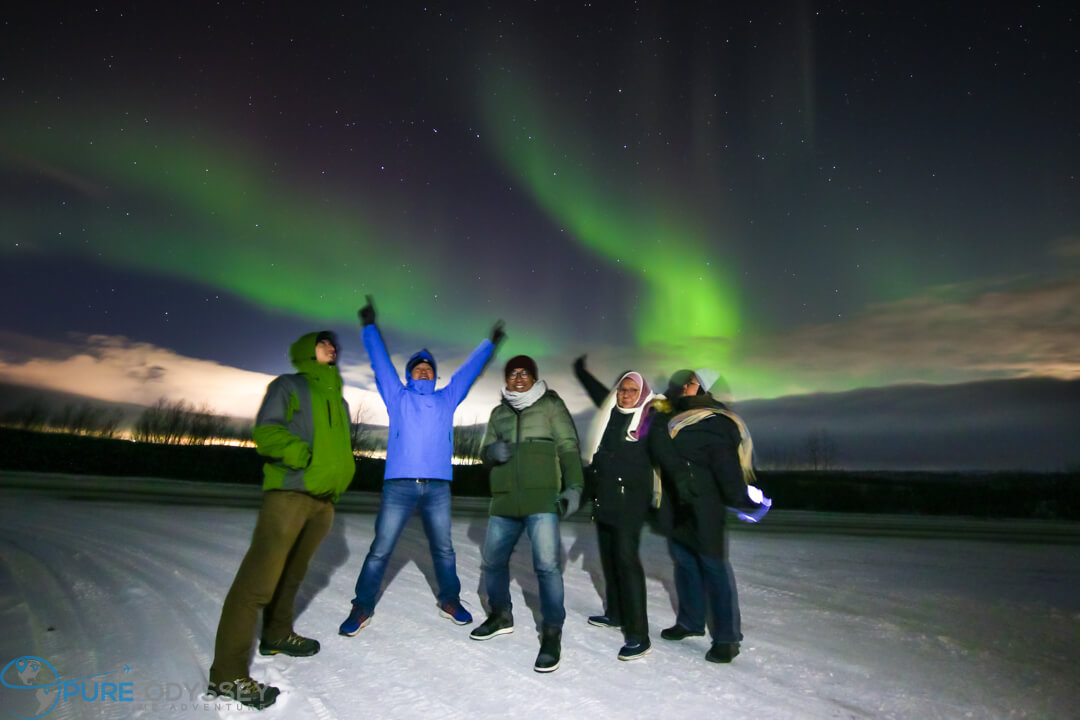 Group photo under the dancing Northern Light